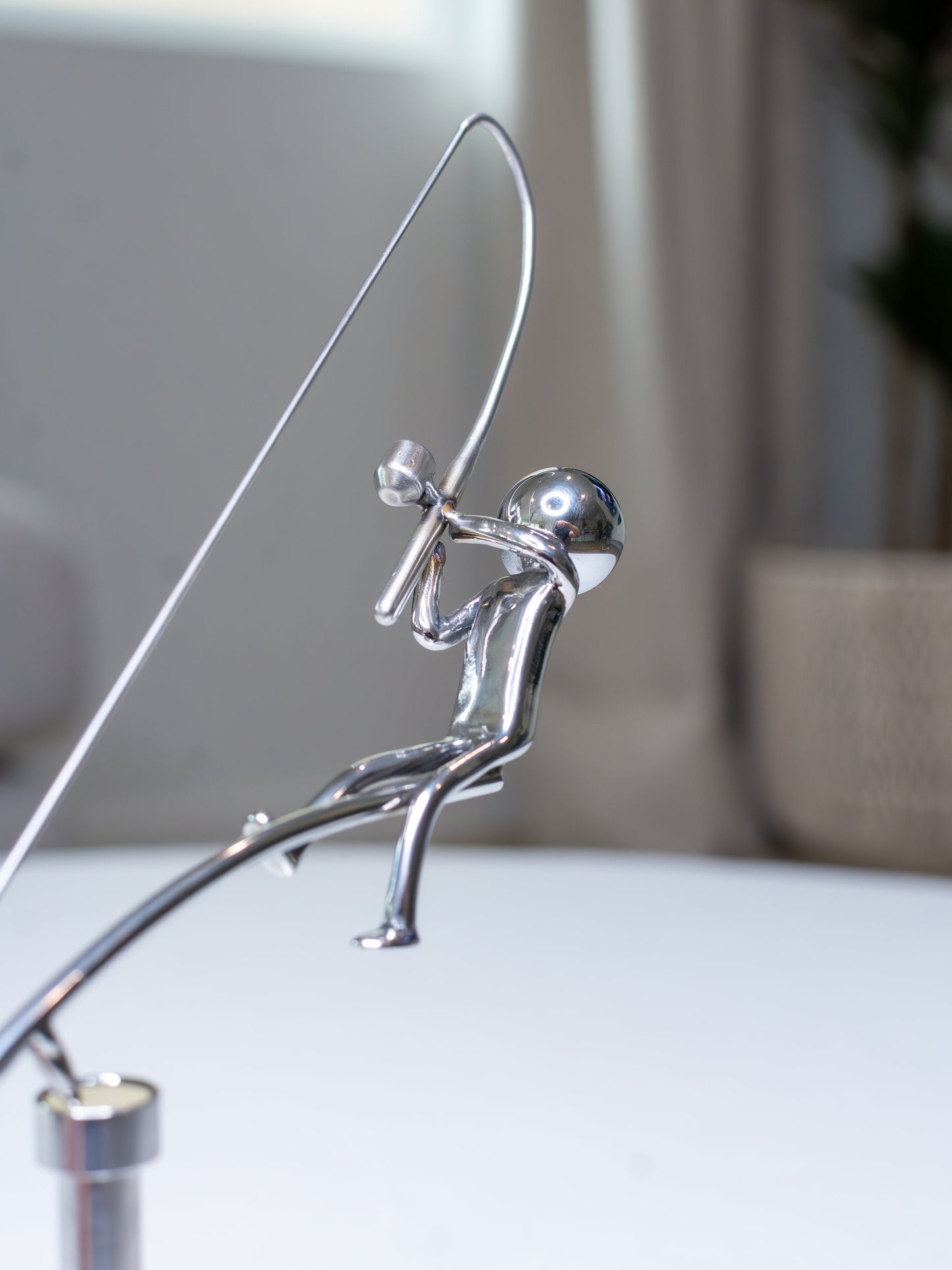 🎣Die balancierende Skulptur des Fischers