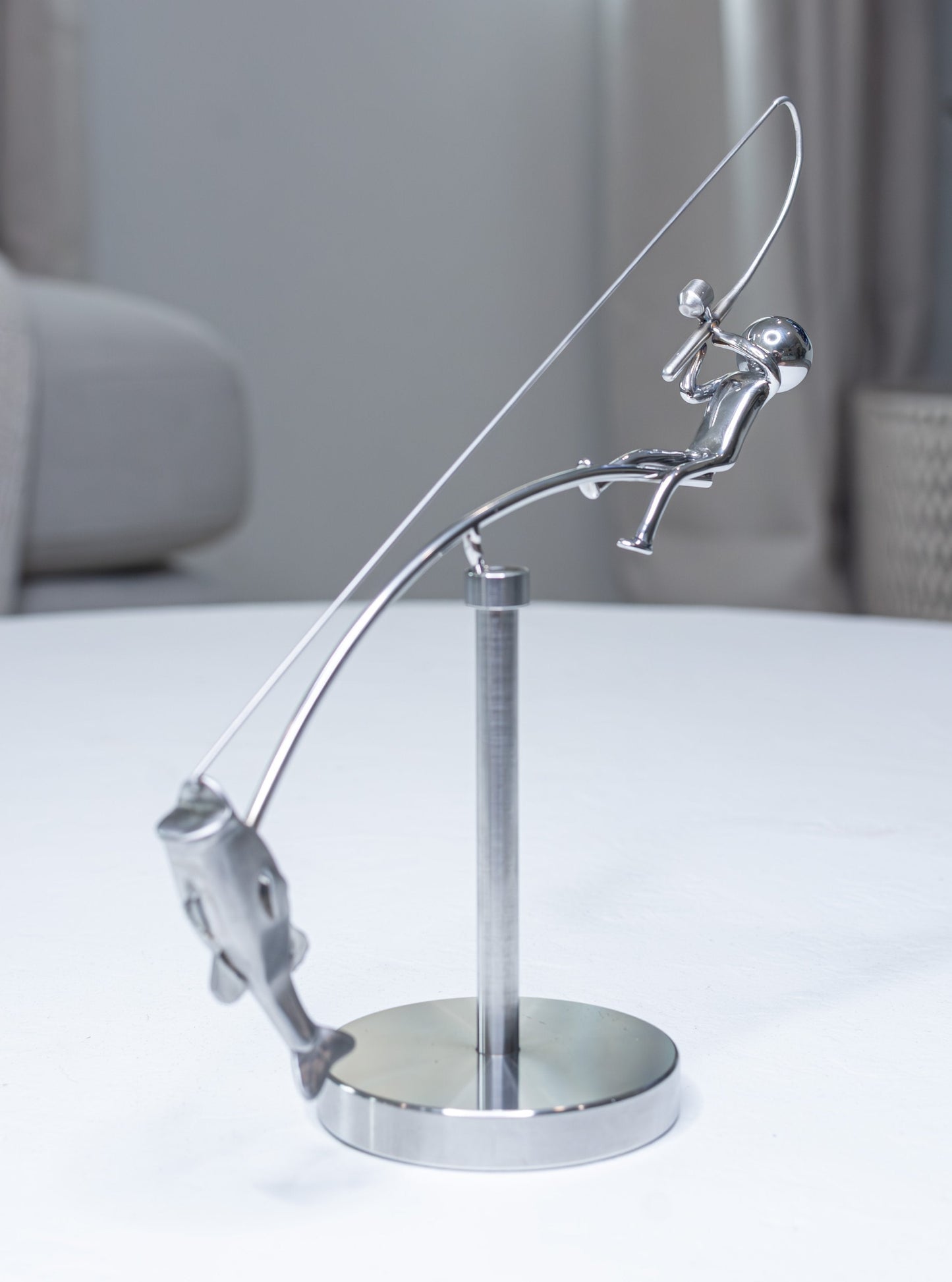 🎣Die balancierende Skulptur des Fischers