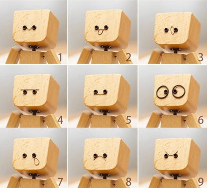 Charmante kleine Holzfigur, die sich mit 12 magnetischen Gesichtsausdrücken bewegt
